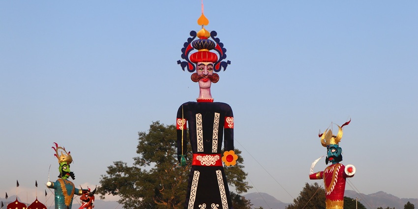 An image of large effigies of Ravana, Meghnath, and Kumbhkaran during Dussehra.