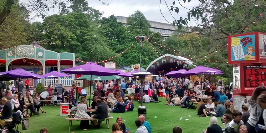 A performer captivating the audience during the Edinburgh Festival Fringe in Scotland.