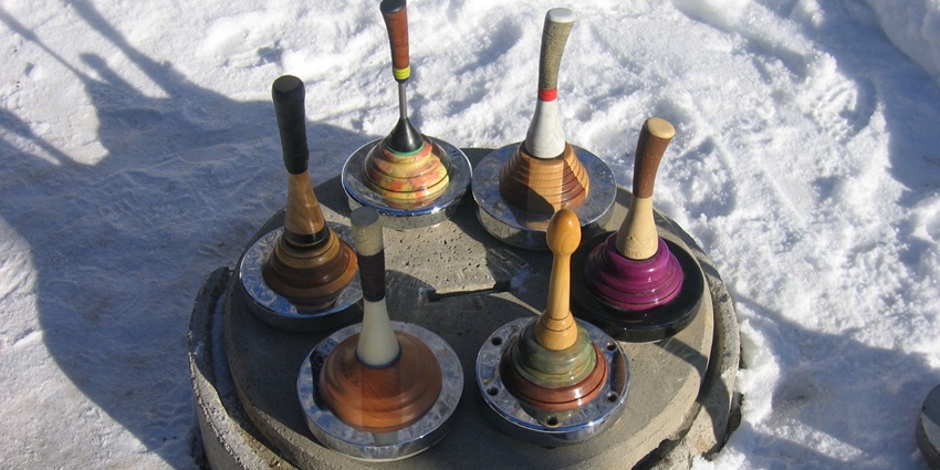 Eisstock on a frozen lake near Hallstatt shows things to do around Hallstatt in winter.