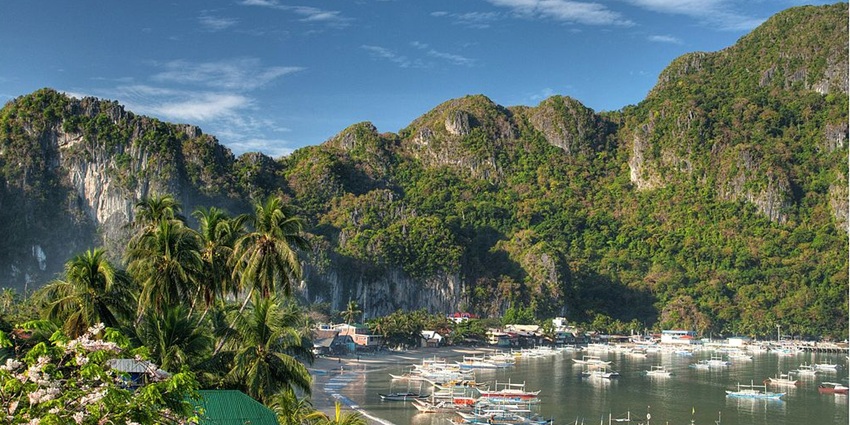 Places to visit in July in Asia include a tropical haven with towering limestone cliffs, hidden lagoons, and crystal-clear waters
