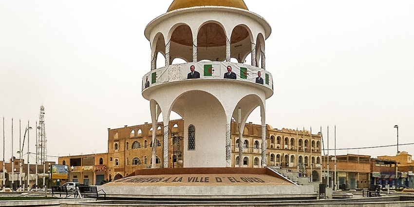 A frontal view of a traditional monument in Algeria with a massive dome