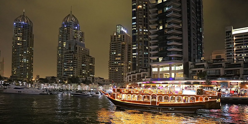 A magical dhow cruise under city lights, one of the must-try things to do in Dubai Creek.