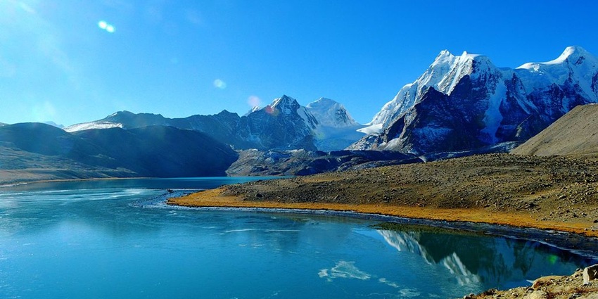 Sikkim’s Gurudongmar Lake with Sanglaphu and Gurdongmar mountains in the background