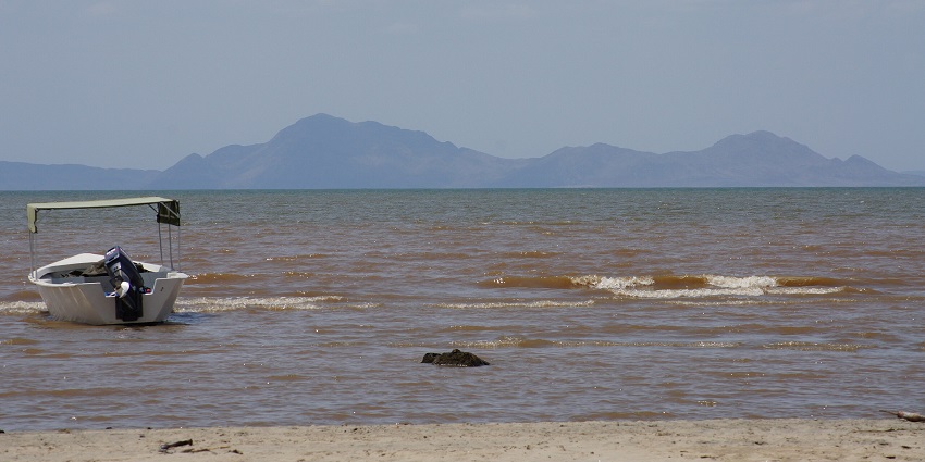 Scenic view of Lake Turkana, Kenya, with its turquoise waters and rugged, arid landscape
