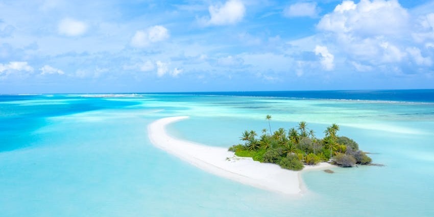 Travel between Maldivian islands, exploring local culture, secluded beaches, and marine biodiversity.