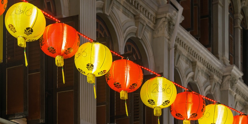 Lanterns drape overhead, while stalls may introduce limited-time treats like mooncakes.