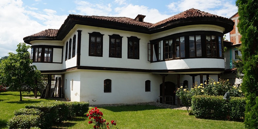 Traditional stone building of the Ethnographical Museum in Gjakova, Kosovo, featuring wooden balconies, one of the best places to visit in Kosovo.