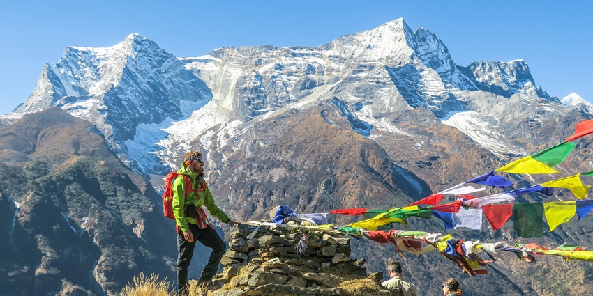 Trekking in March to Everest Base Camp with clear skies, snowy peaks, and mountain trails.