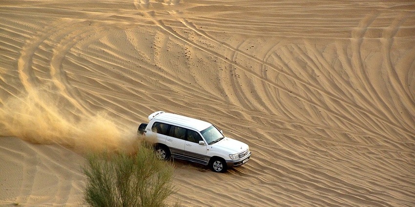 A desert safari with dune bashing, one of the romantic things to do in Dubai for couples.