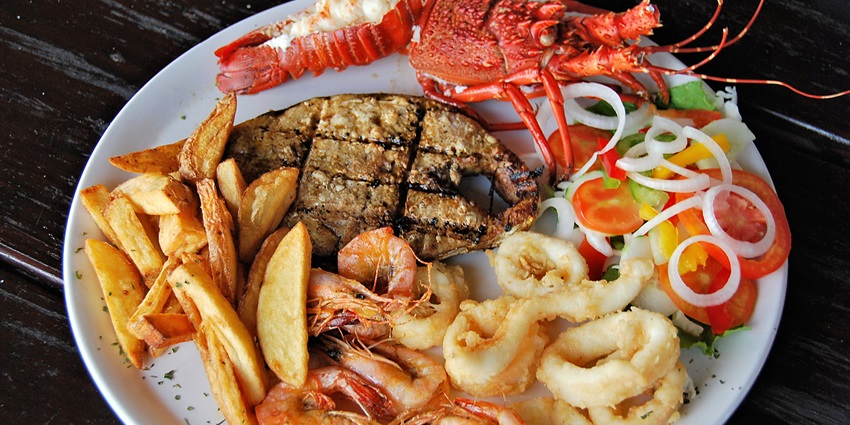 Savouring mouth watering Mozambican, one of the best things to do in tofo mozambique