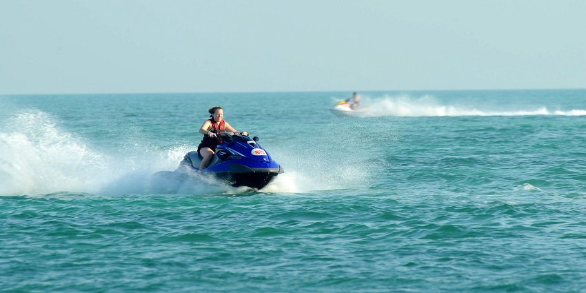 Feel the thrill of fast-paced water travel, gliding across turquoise waves on a speedboat or jet ski.