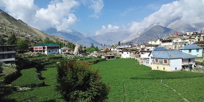 Nako village with traditional-style houses surrounded by greenery and mountains