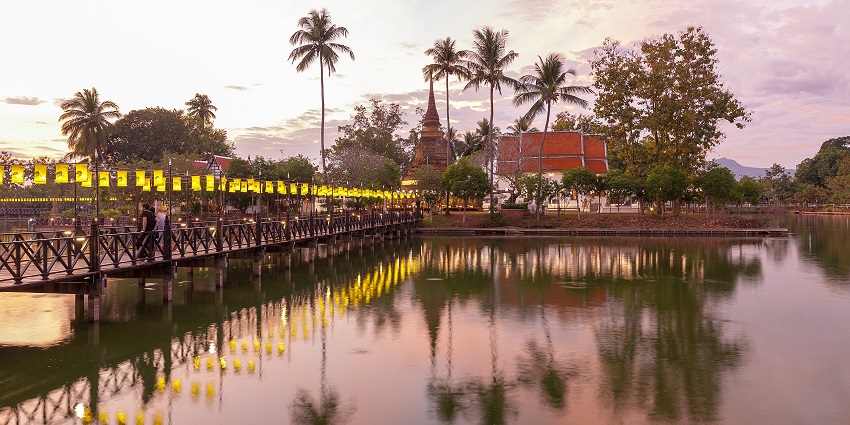 Sukhothai Historical Park photos featuring Wat Traphang Thong, beside a tranquil lotus-filled pond.