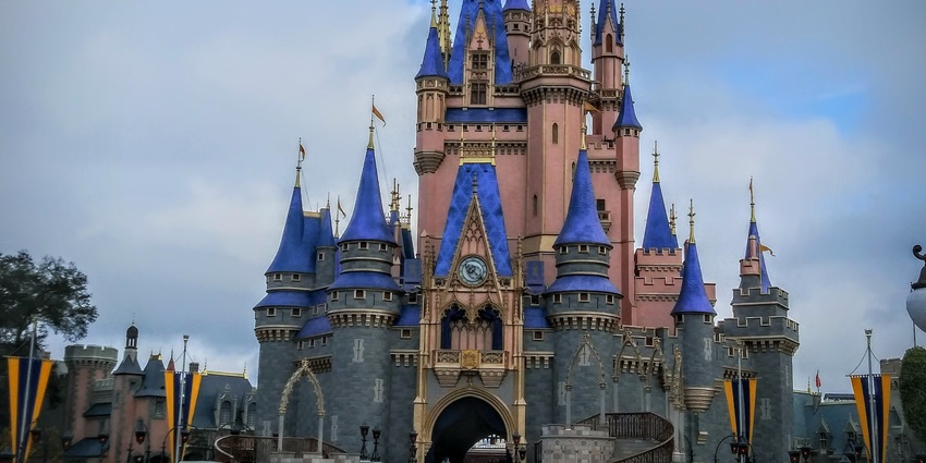 Cinderella Castle at Magic Kingdom Park, glowing beautifully against the sky.