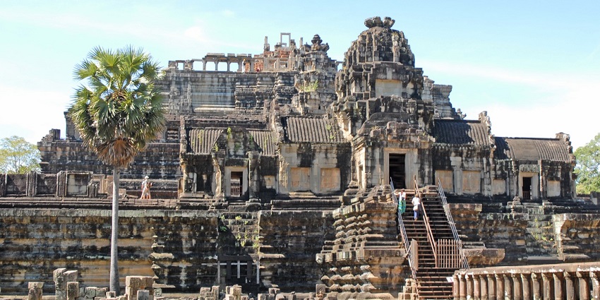 An ancient multi-tiered stone temple of Baphuon, with ornate architecture, exploring which one of the best things to do in Cambodia in February.