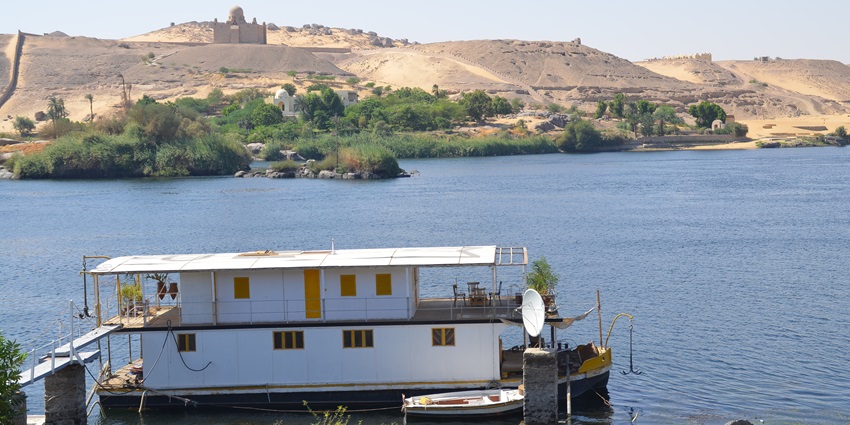 An image of Elephantine Island in Aswan, Egypt, showcasing ancient ruins and the Nile River's scenic beauty.