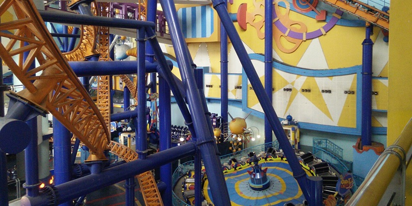 A vibrant indoor amusement park at Ba Na Hills, featuring thrilling rides and attractions