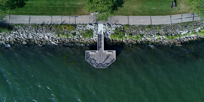 Lakeside park from the top with rocky and green shores, a wooden deck and a walking track.
Viewers of this file can see comments and suggestions