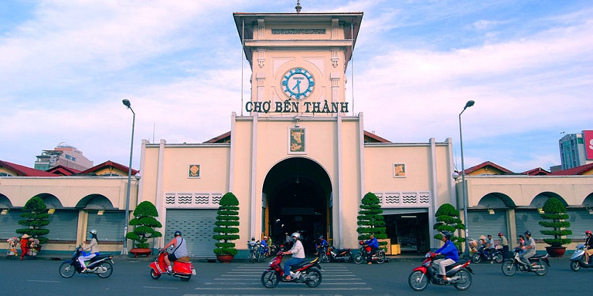 Vibrant stalls at Ben Thanh Market showcasing an array of local handicrafts and souvenirs.