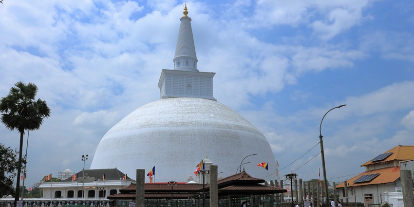 Tourists visit the premises of the Ruwanweli, one of the things to do in Anuradhapura.