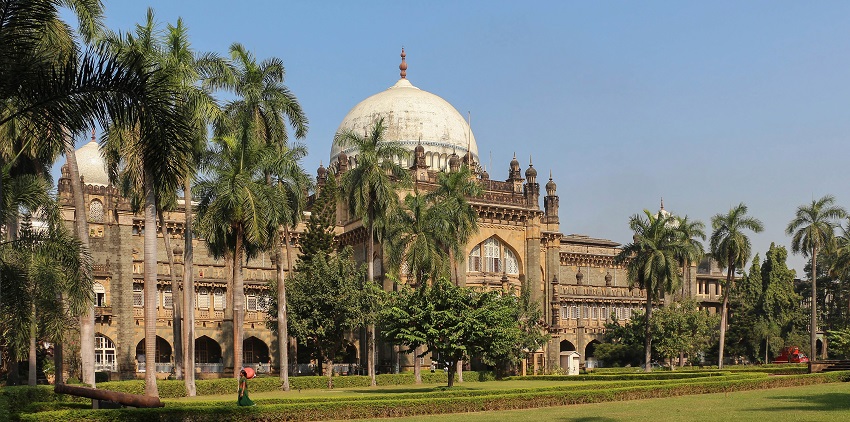 Historic museum building with grand architecture, featuring a central dome and intricate detailing