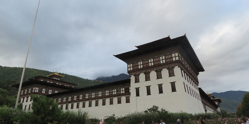 Drukgyel Dzong, a restored fortress in Paro, Bhutan, standing against a scenic backdrop