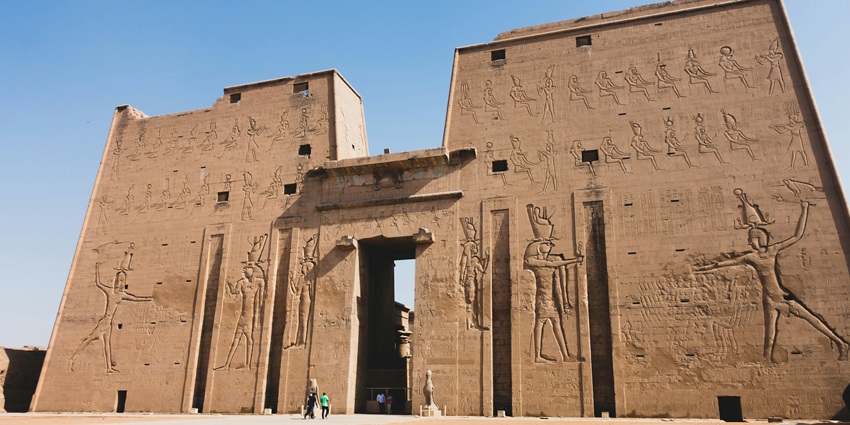 View of ancient tomb walls with colorful hieroglyphics at Saqqara Necropolis.