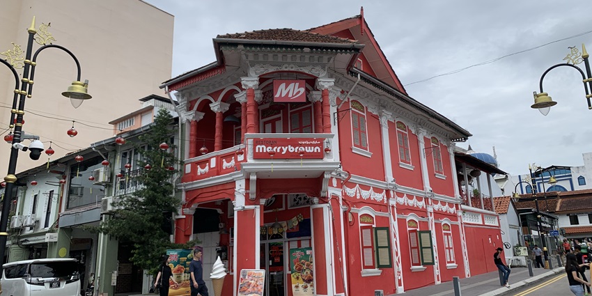 A vibrant panoramic view of the Jalan Tan Hiok Nee street in Johor bahru, Malaysia
