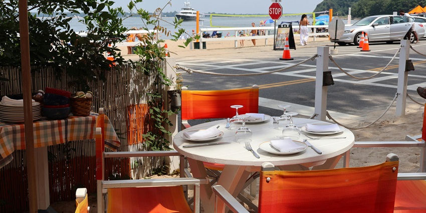Enjoy the vibrant ambience of the beachside bars, featuring delicious food and music.