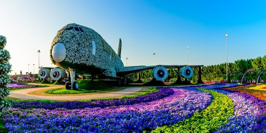 A stunning life-sized Emirates A380 covered in vibrant flowers and greenery