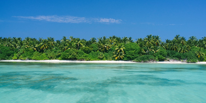 Nggela Islands visible from a distance beyond a large dark blue waterbody of Solomon Islands
