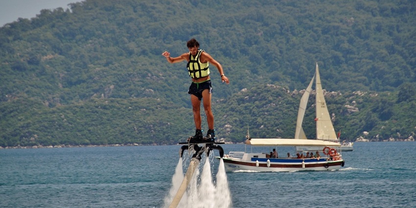 An image resembling flyboarding in Benoa Bali, one of the best water sports in Benoa.