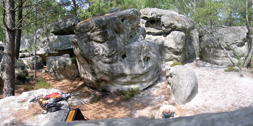 Climbers navigate sandstone boulders in Fontainebleau, a top outdoor rock climbing spot