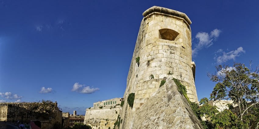 A scenic view of Fort Saint Elmo, showing its historic bastion fort walls, coastal setting