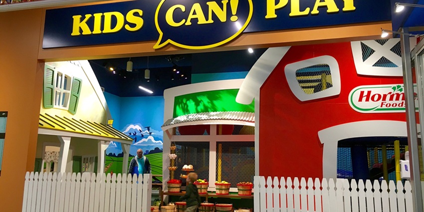 An image of a toddler playing and enjoying in the play zone of Fun City Mall.