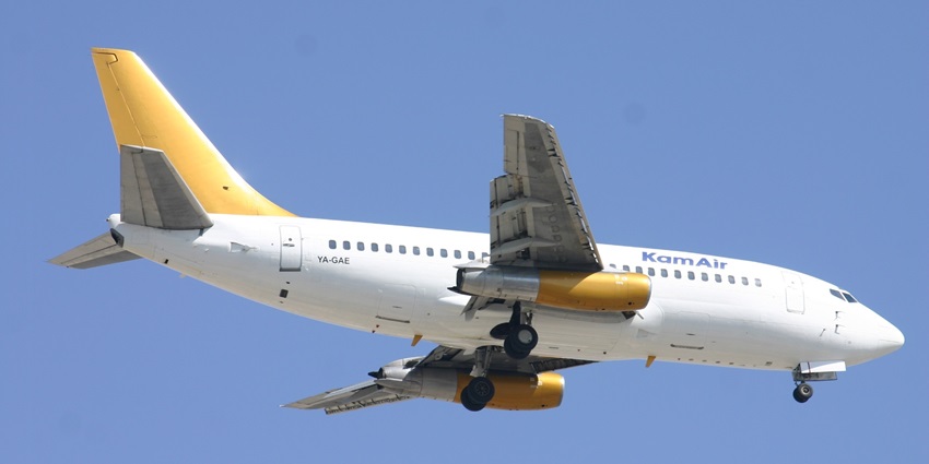 YA-GAE Boeing 737 Kam Air in yellow and white soaring through a clear blue sky