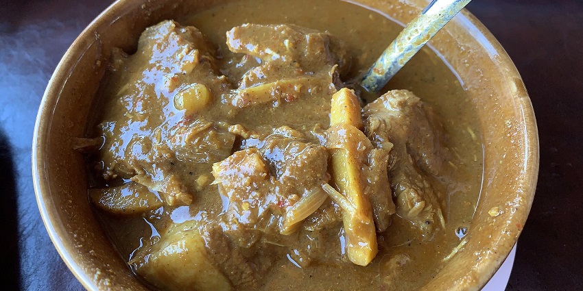 Gaeng Hang Lay, Northern Thai curry with pork, tamarind, ginger, and spices, showcasing local food in Chiang Mai