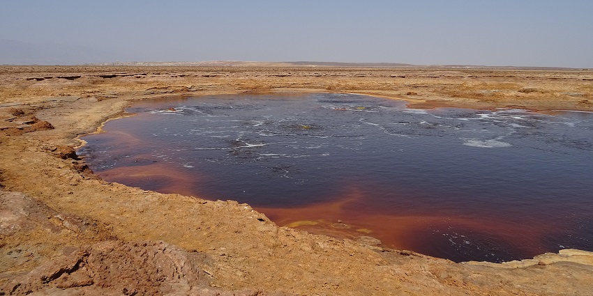 Gaet’ale Pond, one of the saltiest lakes in the world, with mineral-rich waters and a rugged landscape