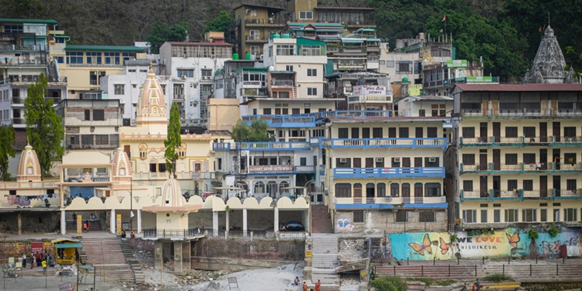 Two men sitting near a small ashram, showcasing the beauty of the best place near Bhudargad Fort.