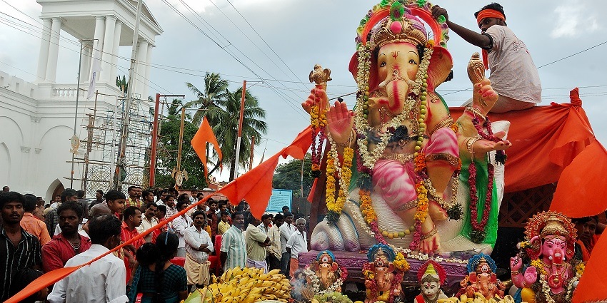 An image showing people celebrating Ganesh Chaturthi with rituals in Trivandrum, Kerala.