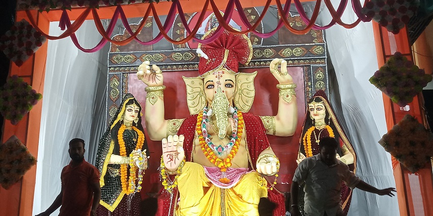 A Hindu festival honoring Lord Ganesha with processions, prayers, and celebrations