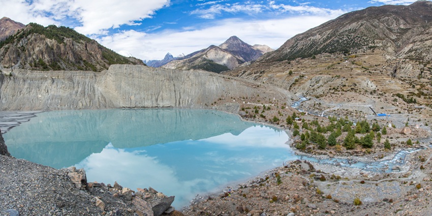 View of Lake Gangapurna with turquoise waters and snowy peaks