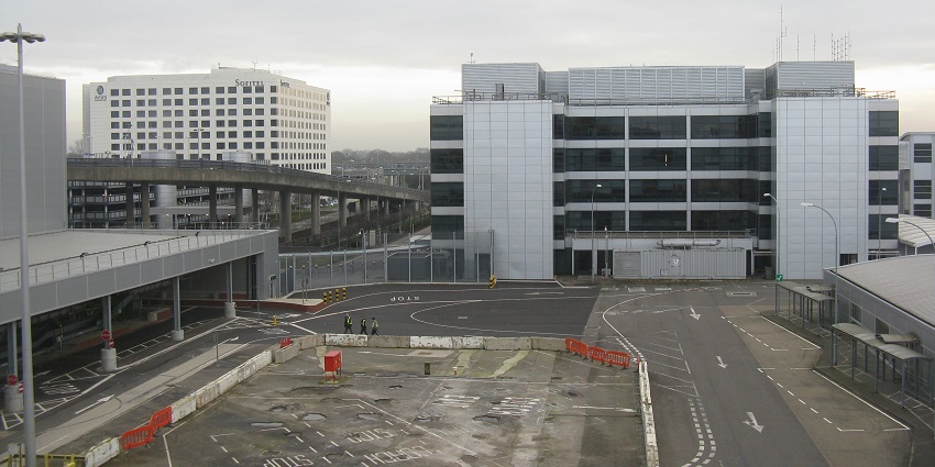 The exterior view of Gatwick Airport’s terminal building, surrounded by roadways.