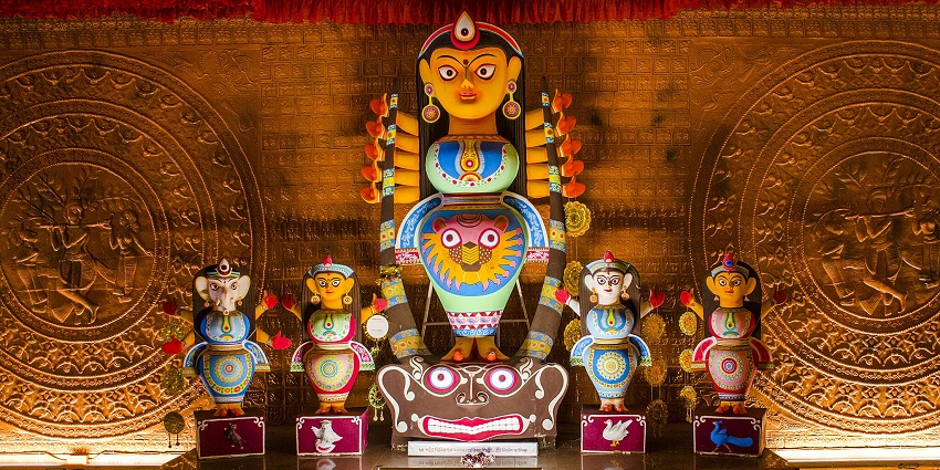 An image of three goddesses, Santoshi Mata, Gayatri Mata and Annapurna Mata, being worshiped, during the Gayatri Jayanti festival in India.