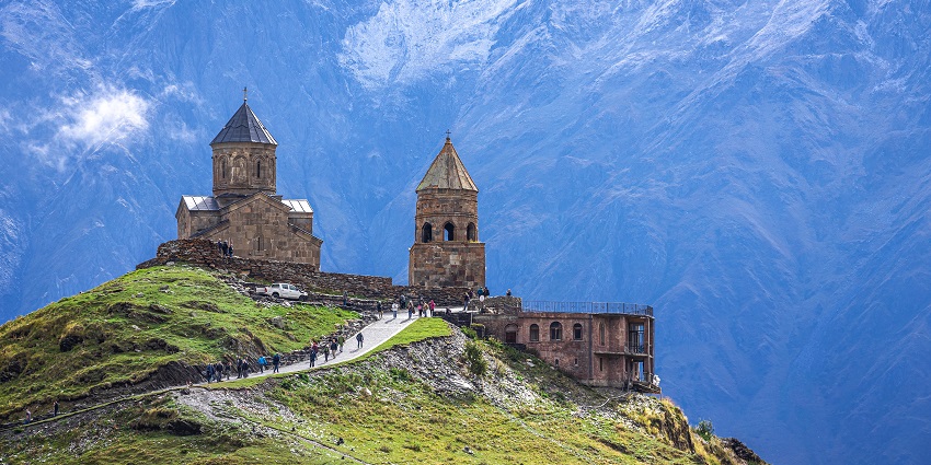 Scenic church located on a mountain with stunning views, among the best places to visit as per the Georgia travel guide