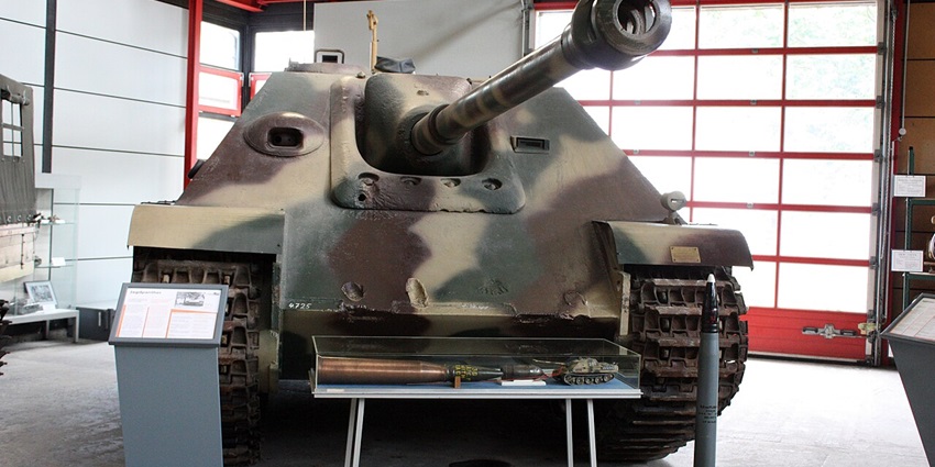 A German soldier's uniform and military vehicles at the German Tank Museum.