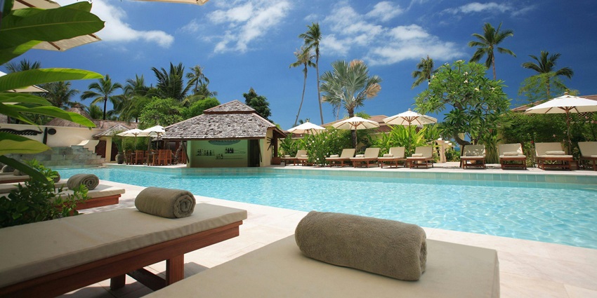Image of a resort near a pool facing beach views - enjoy relaxing massages