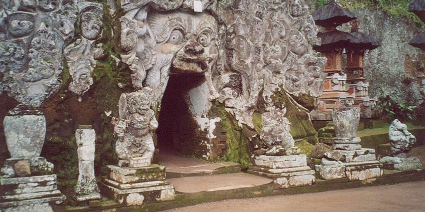 Goa Gajah Elephant Cave with intricate carvings, Hindu-Buddhist relics, and gardens.