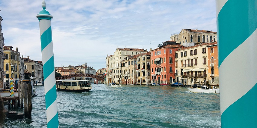 Glide through Venice’s Grand Canal on a gondola, witnessing elegant palaces.