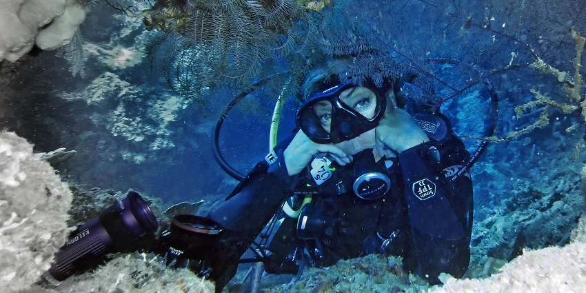 An image showing a woman diving at Grand Island, exploring water sports in Goa